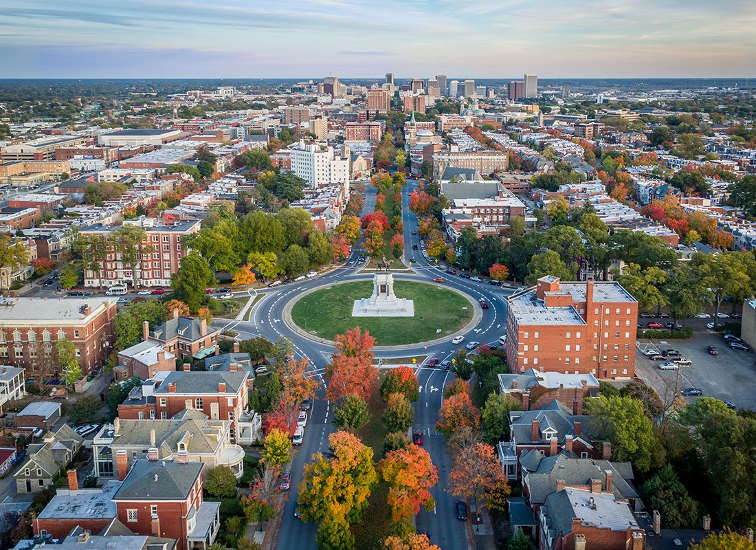 Contact - Aerial View of Richmond, Virginia With City Buildings and a Monument in the Middle of the City