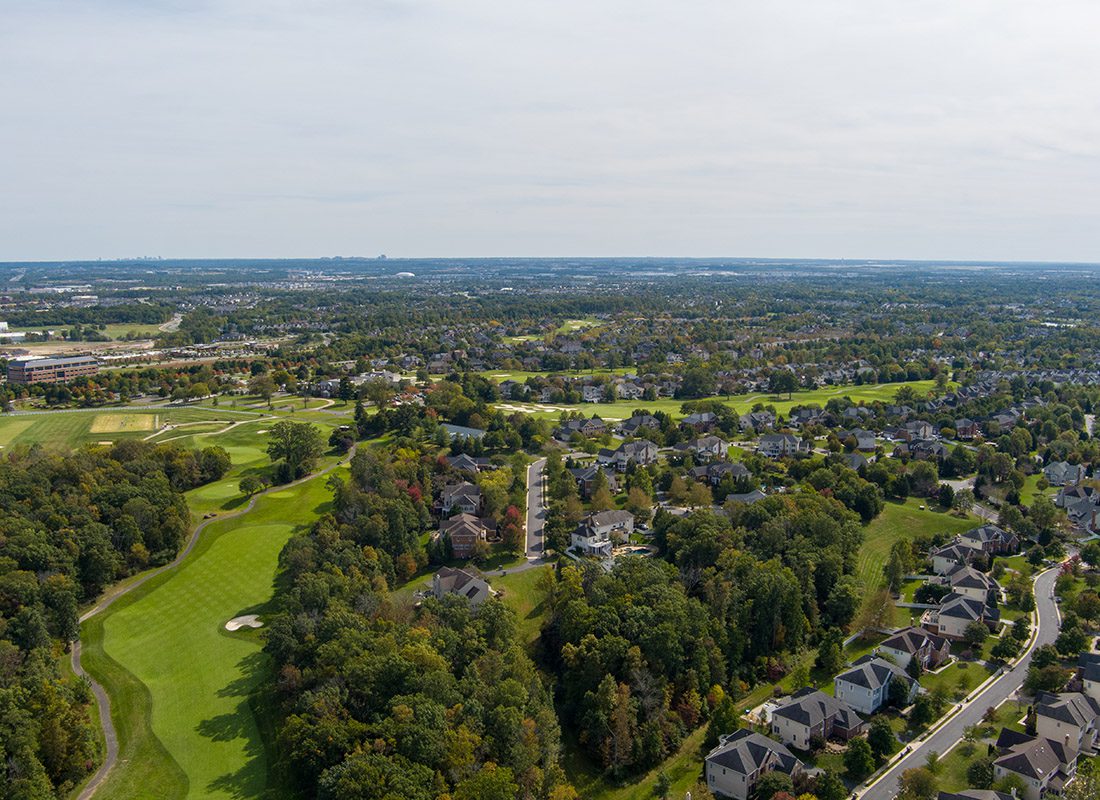 Midlothian, VA - Aerial View of Virginia Homes With Trees and a Golf Course Nearby on a Sunny Day
