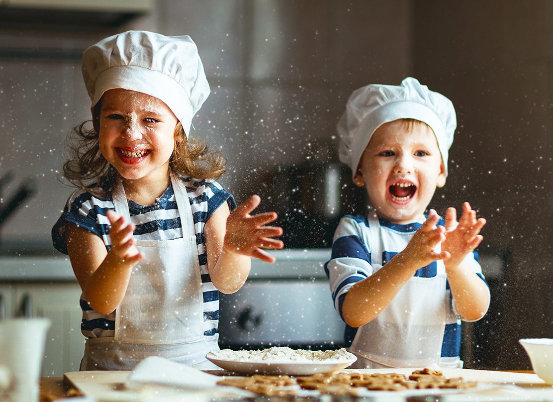 About Our Agency - Two Children Play With Baking Powder While Baking Cookies