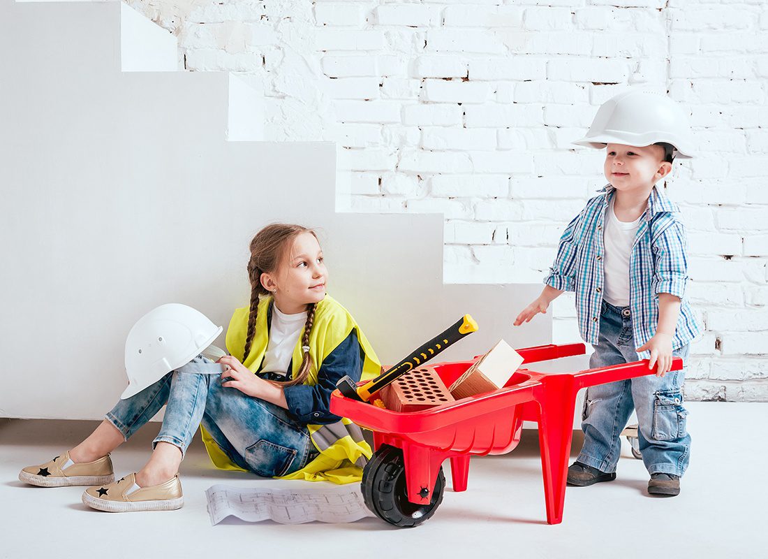 Insurance by Industry - Two Small Children Pretend to do Construction Work